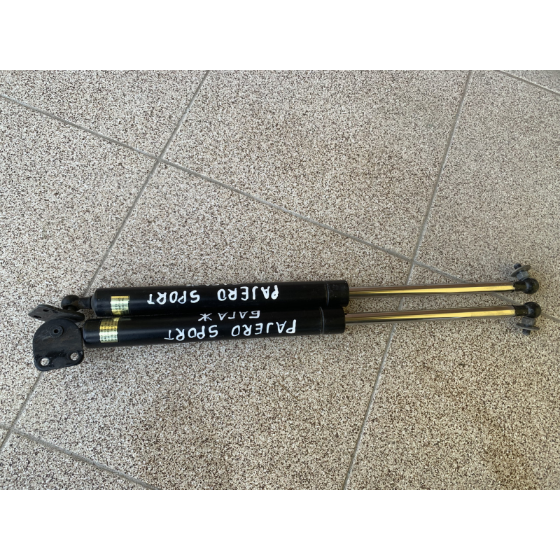 Амортизатор кришки багажника Mitsubishi Pajero Sport 1